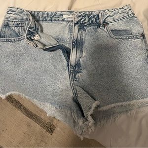 High waisted distressed light wash demon shorts
